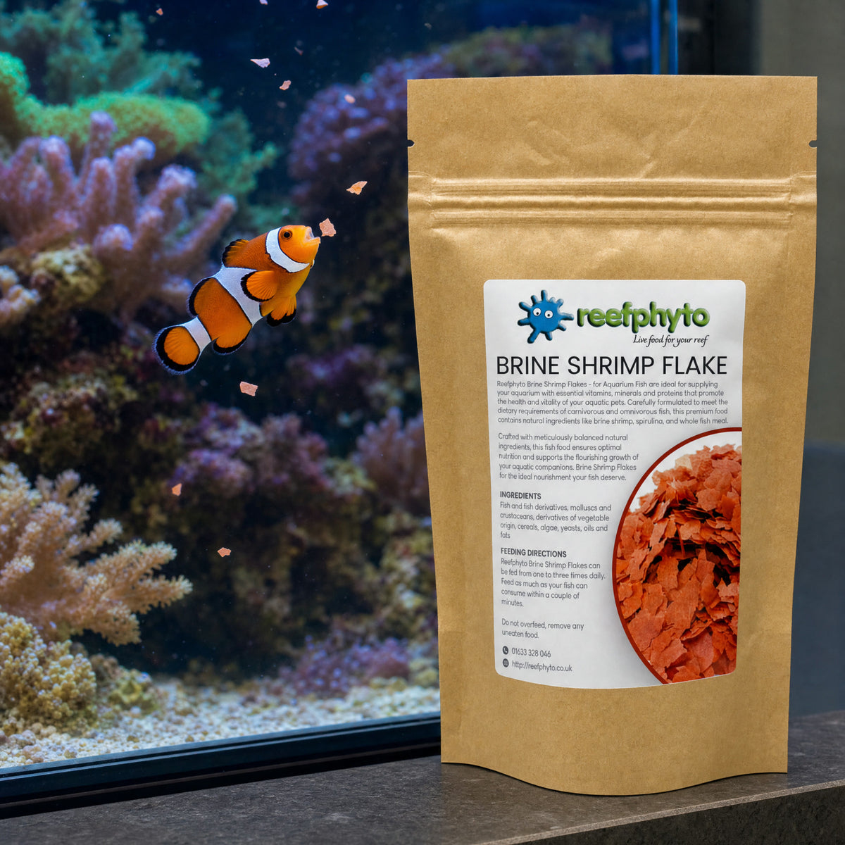 Clownfish rising to eat Reefphyto Brine Shrimp Flake in a reef aquarium beside the pouch