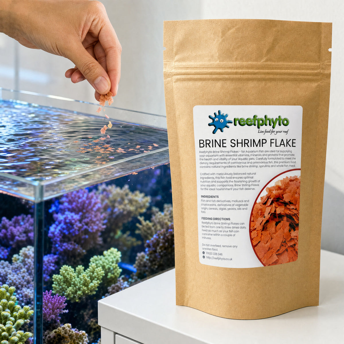 Sprinkling Reefphyto Brine Shrimp Flake onto the surface of a reef aquarium