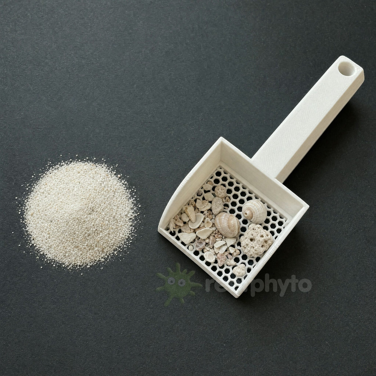 White Reefphyto Mini Sand Sieve holding shells and rubble beside a mound of clean sifted sand